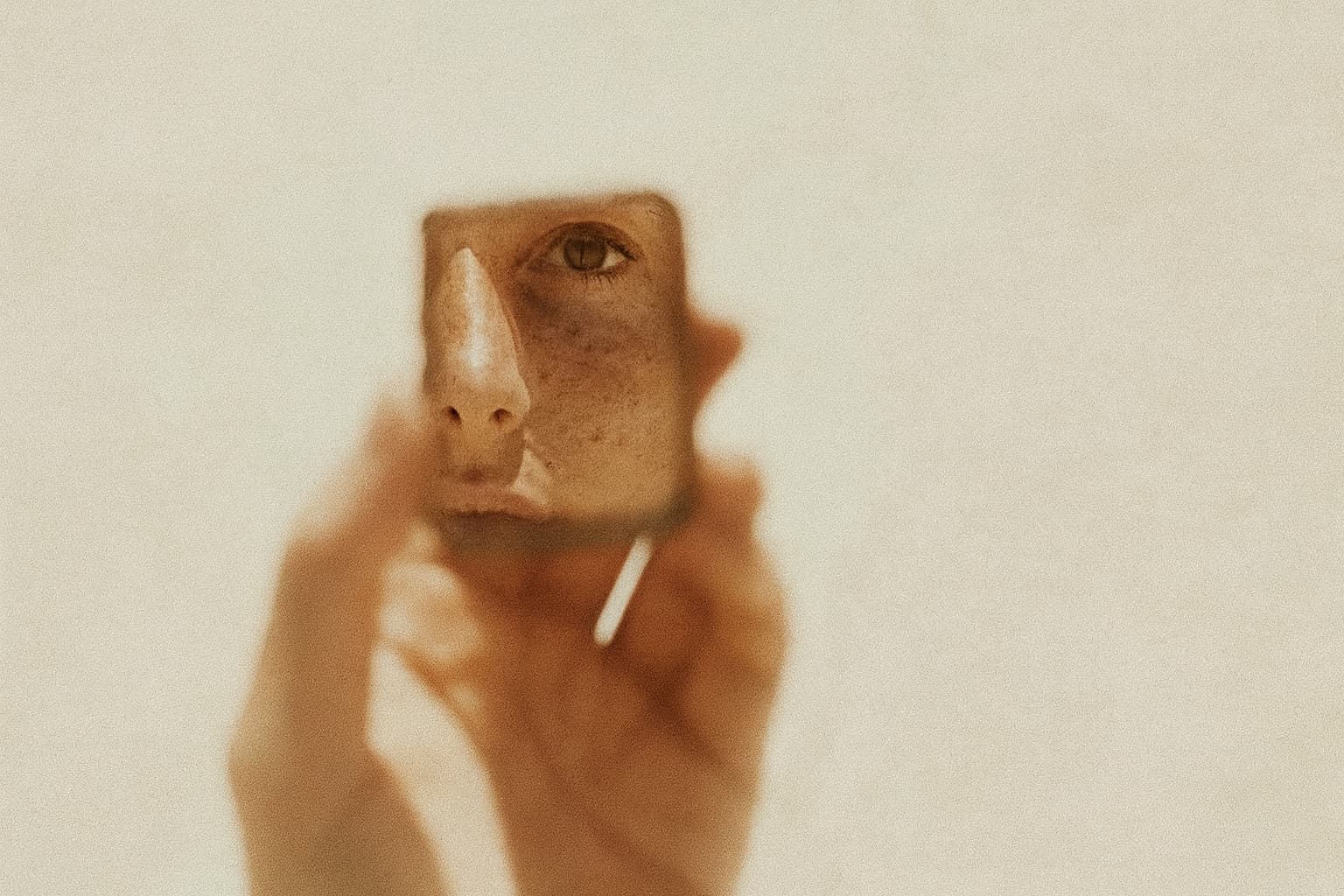 Eye reflected in a handheld mirror